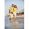 happy senior mature elderly people couple have romantic time on beach at sunset 