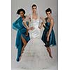 portrait of a three beautiful woman in wedding dress, bride and her friends bridesmaid