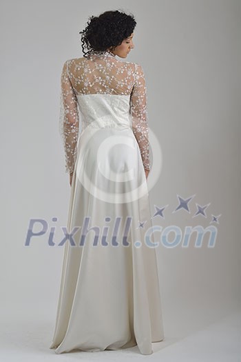 elegant woman in fashionable stylish dress posing in the studio elegant woman in fashionable stylish dress posing in the studio