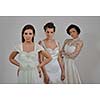 portrait of a three beautiful woman in wedding dress, bride and her friends bridesmaid