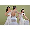 portrait of a three beautiful woman in wedding dress, bride and her friends bridesmaid