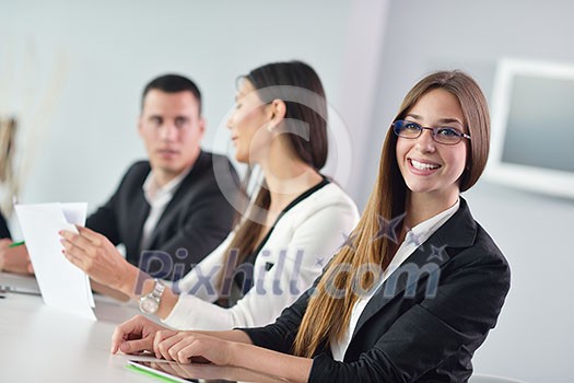 Group of happy young business people in a meeting at office Group of happy young business people in a meeting at office