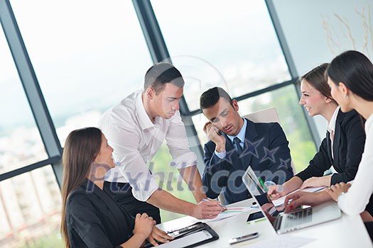 Group of happy young business people in a meeting at office Group of happy young business people in a meeting at office