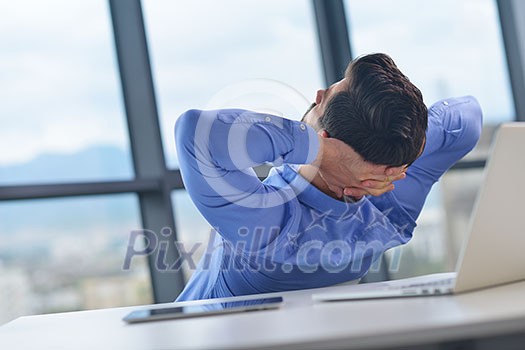 happy young business man work in modern office on computer happy young business man work in modern office on computer