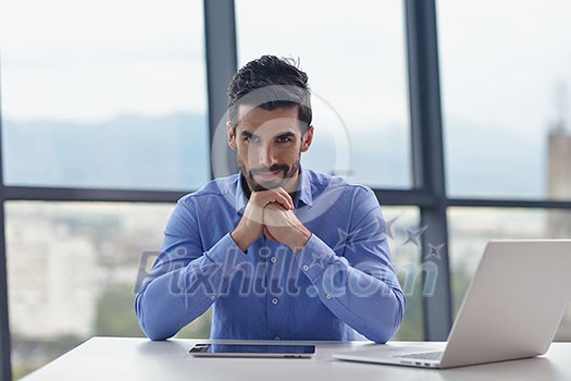 happy young business man work in modern office on computer happy young business man work in modern office on computer