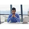 happy young business  man work in modern office on computer