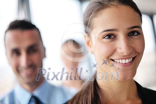 happy young business woman with her staff, people group in background at modern bright office indoors happy young business woman with her staff, people group in background at modern bright office indoors