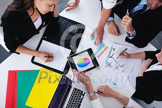 Group of happy young business people in a meeting at office Group of happy young business people in a meeting at office