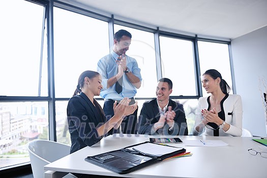 Group of happy young business people in a meeting at office Group of happy young business people in a meeting at office