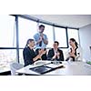 Group of happy young  business people in a meeting at office