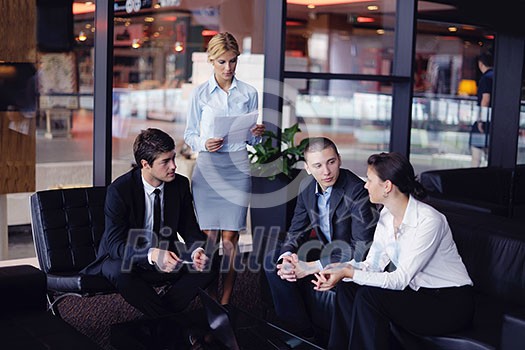 Group of happy young business people in a meeting at office Group of happy young business people in a meeting at office