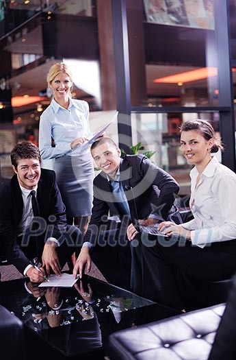Group of happy young business people in a meeting at office Group of happy young business people in a meeting at office