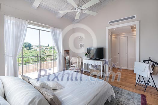 Airy, light bedroom with wooden floor Airy, light bedroom with wooden floor