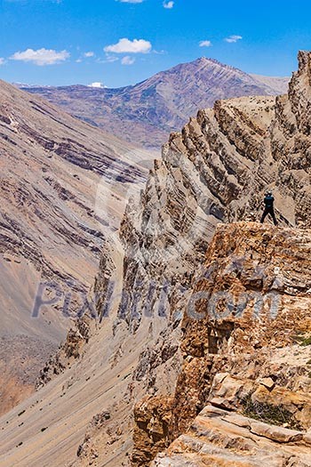 Photographer taking photos in Himalayas mountains. Spiti valley, Himachal Pradesh, India