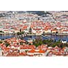 Aerial view of Charles Bridge over Vltava river and Old city from Petrin hill Observation Tower with tilt shift toy effect shallow depth of field. Prague, Czech Republic