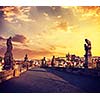 Vintage retro effect filtered hipster style travel image of Charles bridge and Prague castle in the early morning on surise. Prague, Czech Republic