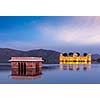 Rajasthan landmark - Jal Mahal Water Palace on Man Sagar Lake in the evening in twilight.  Jaipur, Rajasthan, India