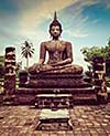 Vintage retro effect filtered hipster style travel image of Buddha statue hand close up detail. Sukhothai, Thailand