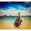 Vintage retro effect filtered hipster style travel image of long tail boat on tropical beach, Krabi, Thailand