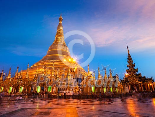 Myanmer famous sacred place and tourist attraction landmark - Shwedagon Paya pagoda illuminated in the evening. Yangon, Myanmar Burma Myanmer famous sacred place and tourist attraction landmark - Shwedagon Paya pagoda illuminated in the evening. Yangon, Myanmar Burma