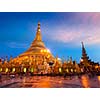 Myanmer famous sacred place and tourist attraction landmark - Shwedagon Paya pagoda illuminated in the evening. Yangon, Myanmar Burma