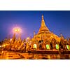 Myanmer famous sacred place and tourist attraction landmark - Shwedagon Paya pagoda illuminated in the evening. Yangon, Myanmar Burma