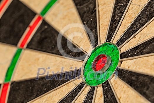 Success hitting target aim goal achievement concept background - bull's eye of darts board close up Success hitting target aim goal achievement concept background - bull's eye of darts board close up