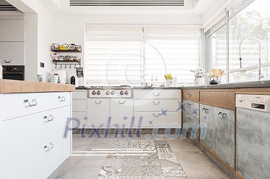 Modern, light kitchen with wooden and white furnishing Modern, light kitchen with wooden and white furnishing