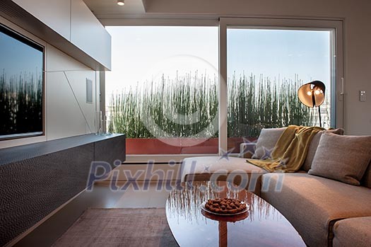 Stylish livingroom with large window Stylish livingroom with large window