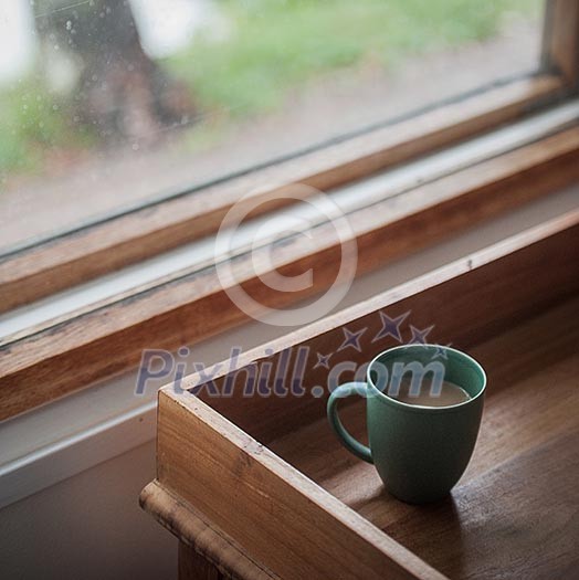 Coffee cup on a wooden tray Coffee cup on a wooden tray