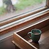 Coffee cup on a wooden tray