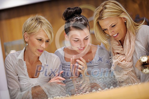 happy girls group have fun while shopping in jewelry store happy girls group have fun while shopping in jewelry store