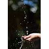beauty and spa fresh water stream on woman hand