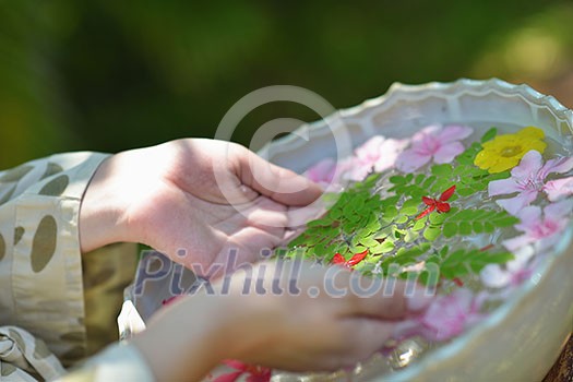 spa and beauty female hand and flower in water spa and beauty female hand and flower in water