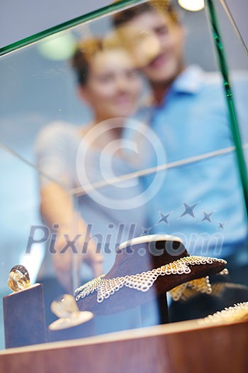happy young romantic couple in love buy jewelry ring in luxury store happy young romantic couple in love buy jewelry ring in luxury store