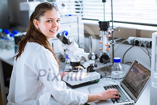 Portrait of a female chemistry student carrying out research in a chemistry lab (color toned image; shallow DOF) Portrait of a female chemistry student carrying out research in a chemistry lab (color toned image; shallow DOF)