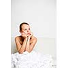 Beautiful bride getting ready for her wedding day, being pensive, waiting for something
