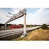 truck passing through a toll gate on a highway (motion blurred image; color toned image)