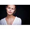 Very retty young woman's simple studio portrait, without too much retouching  (color toned image; shallow DOF)