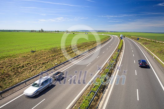 highway traffic on a lovely, sunny summer day highway traffic on a lovely, sunny summer day