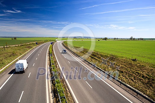 highway traffic on a lovely, sunny summer day highway traffic on a lovely, sunny summer day
