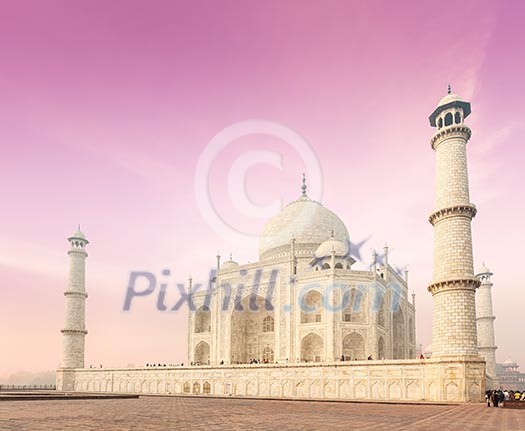 Taj Mahal on sunrise. Indian Symbol - India travel background. Agra, India Taj Mahal on sunrise. Indian Symbol - India travel background. Agra, India