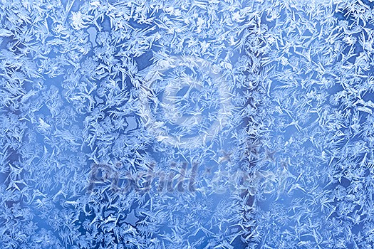 Frost patterns on window glass in winter Frost patterns on window glass in winter