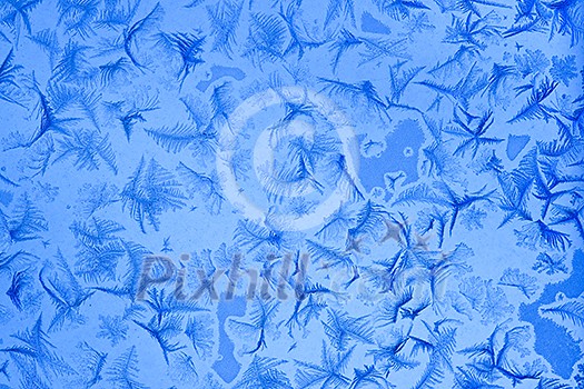 Frost patterns on window glass in winter Frost patterns on window glass in winter