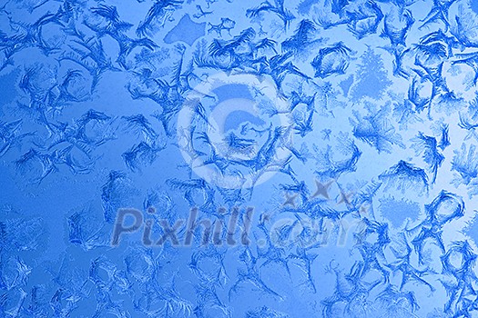 Frost patterns on window glass in winter Frost patterns on window glass in winter