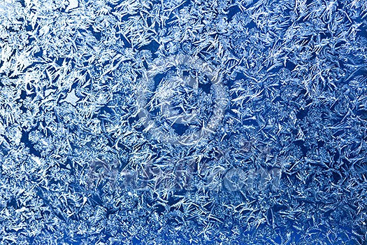 Frost patterns on window glass in winter Frost patterns on window glass in winter