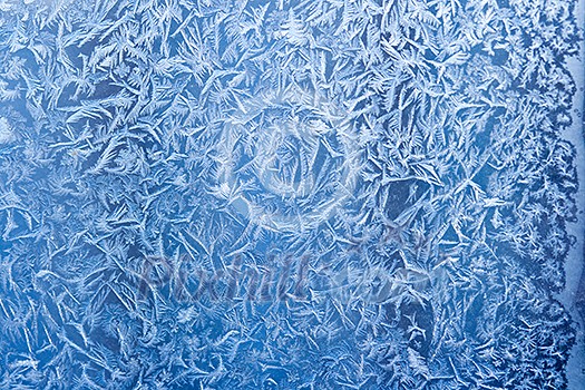 Frost patterns on window glass in winter Frost patterns on window glass in winter