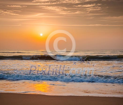 Sunrise on beach with dramatic sky Sunrise on beach with dramatic sky