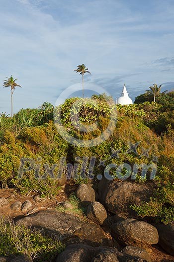 Small Buddhist dagoba on sunset. Unawatuna, Sri Lanka Small Buddhist dagoba on sunset. Unawatuna, Sri Lanka