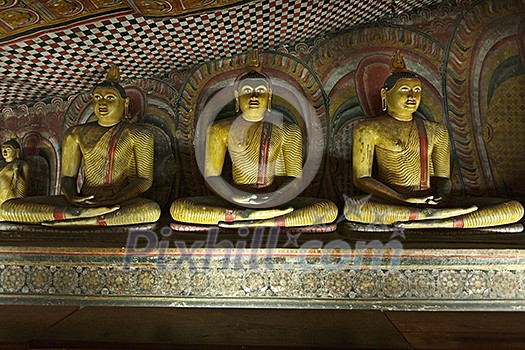 Ancient sitting Buddha images in Dambulla Rock Temple caves, Sri Lanka Ancient sitting Buddha images in Dambulla Rock Temple caves, Sri Lanka